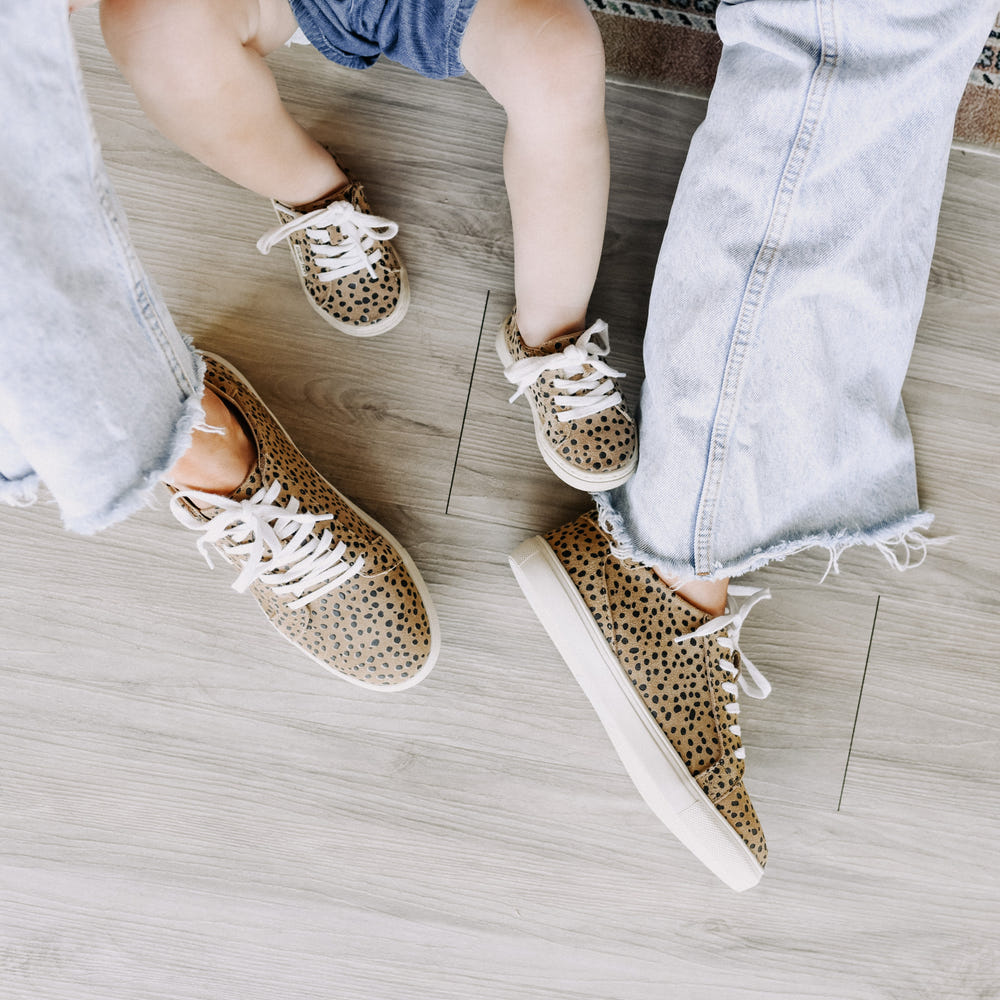 Cheetah print low top sneakers for adults, stylish and comfortable footwear for everyday wear.