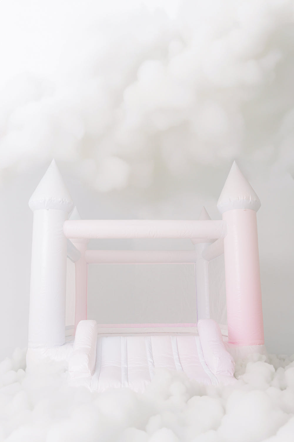 Mini Candy pink and blue tie dye bounce house for outdoor playsets, perfect for kids' fun and entertainment.