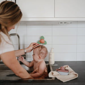 Colorful Dino Suction Spinner Toy for babies, perfect for bath time fun and sensory play.