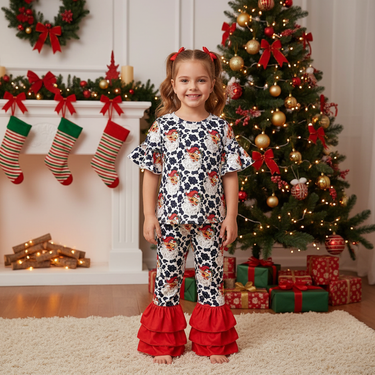 Cow spots Santa two-piece ruffle set for babies, perfect for festive holiday outfits.
