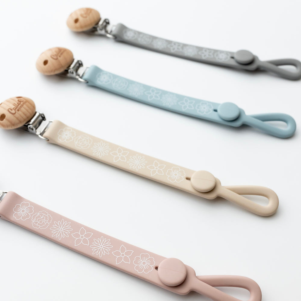Nash Everything Clip in Blossom design, a stylish and functional pacifier clip for babies.