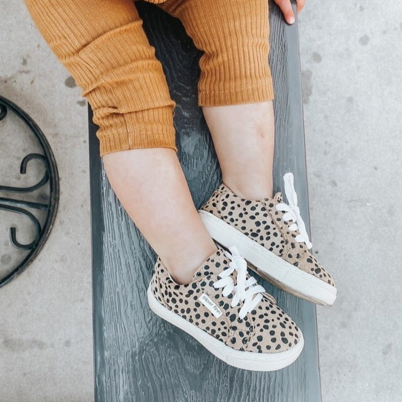 Cheetah low top sneakers for babies, stylish and comfortable footwear for little ones.