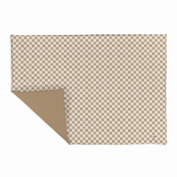 Checker Toffee Organic Cotton Mat for babies, perfect for playtime, shown at an angle for a stylish view.