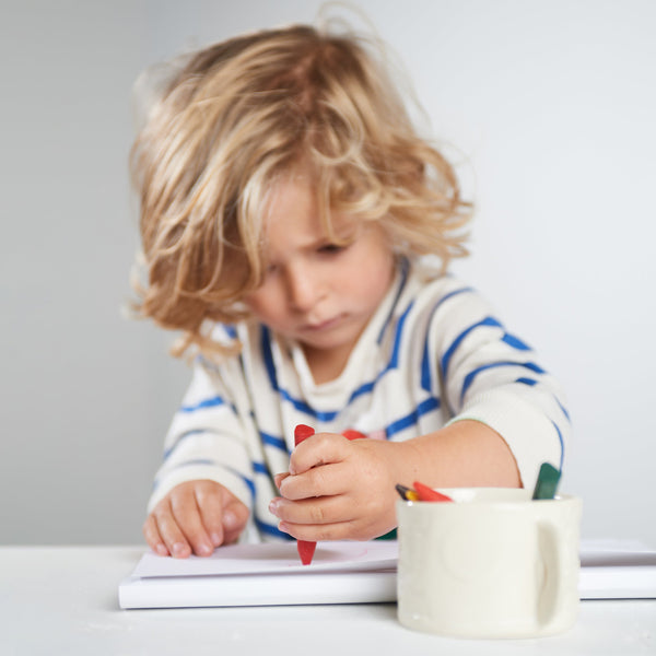 Triangle non-toxic beeswax crayons in vibrant colors, perfect for safe and creative play for babies and toddlers.