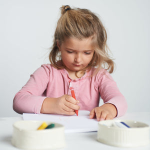 Triangle non-toxic beeswax crayons in vibrant colors, perfect for safe and creative play for babies and toddlers.