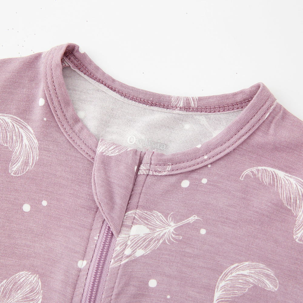 Bamboo long sleeve zip footless baby pajamas in feather mauve, soft and breathable for ultimate comfort.