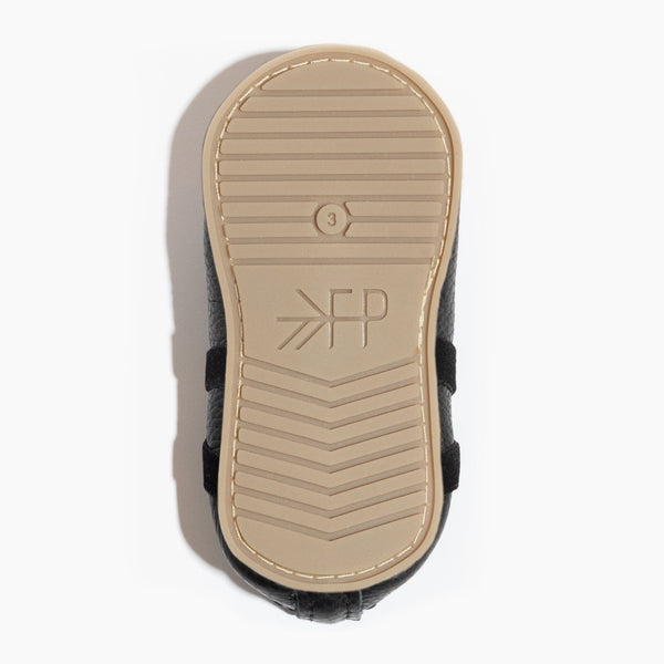 Ebony ballet slipper baby shoe, angle view, perfect for tiny dancers and stylish infants.