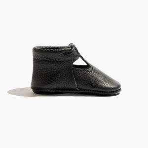 Ebony T-Bar Baby Shoe in angle 3 view, stylish and comfortable for little feet.
