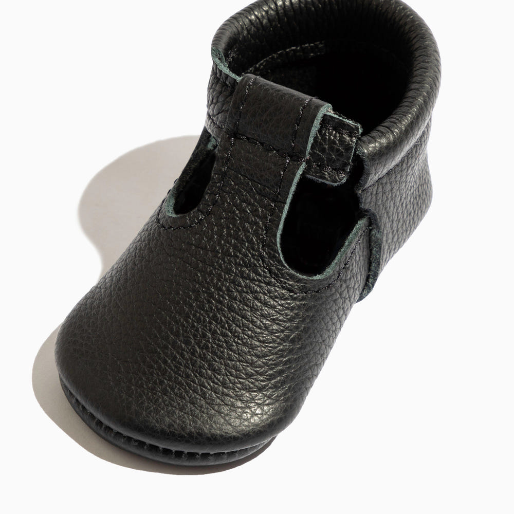 Ebony T-Bar Baby Shoe - stylish and comfortable footwear for infants, perfect for any occasion.