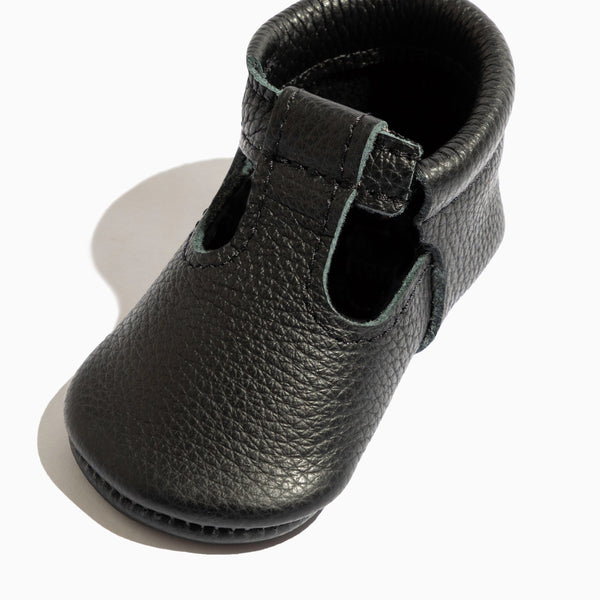 Ebony T-Bar Baby Shoe from angle 2, stylish and comfortable footwear for infants.