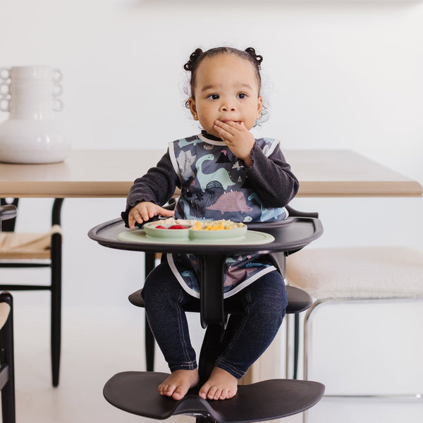 Dinosaur Drawing Bapron for babies, angled view showcasing colorful design and practical features for mess-free mealtime.