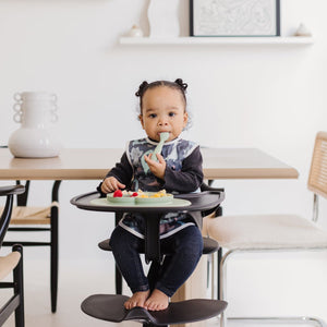 Dinosaur Drawing Bapron for babies, angled view showcasing fun design and practical use for mealtime messes.