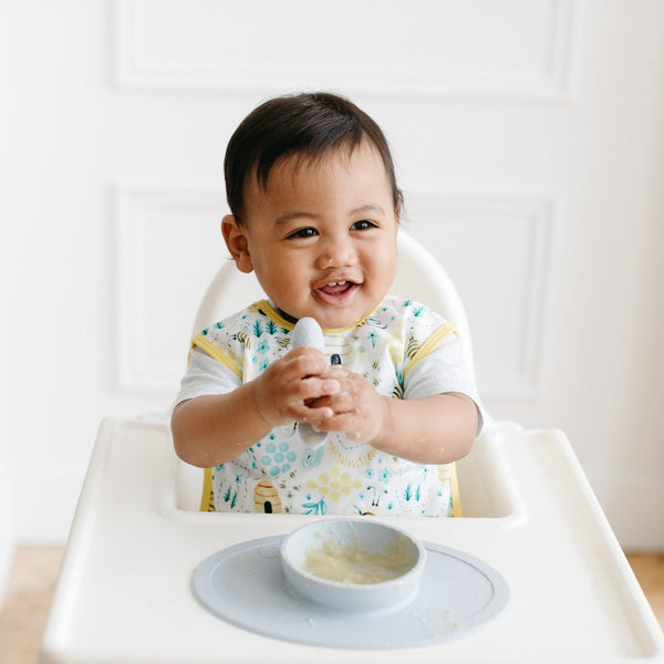 Busy Bees Bapron in Angle 7, featuring a colorful bee design for mess-free feeding and playtime for babies.