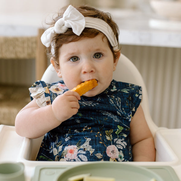 Boho Floral Bapron for babies, showcasing vibrant patterns from angle 2. Perfect for mess-free mealtime!