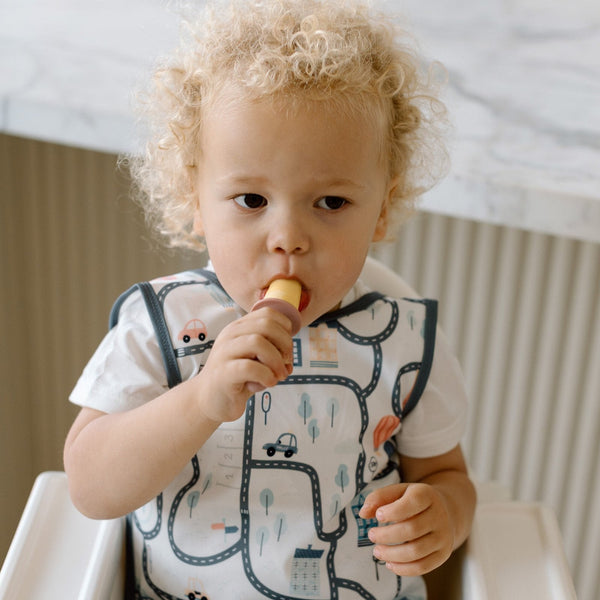 Tiny Town Bapron for babies, stylish and functional, shown at angle 8 for a clear view of design and features.
