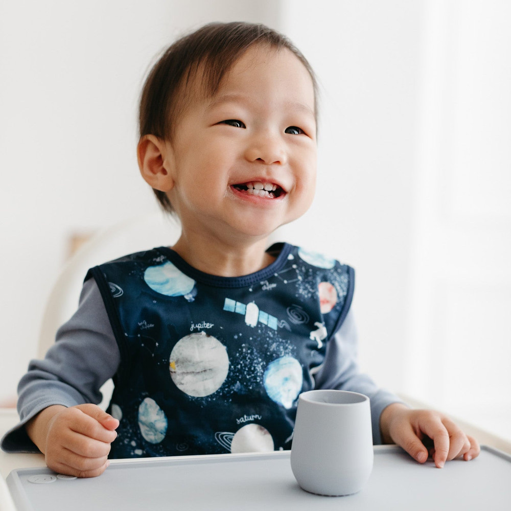 Outer Space Bapron for babies, featuring a fun space-themed design, perfect for mealtime and playtime messes.