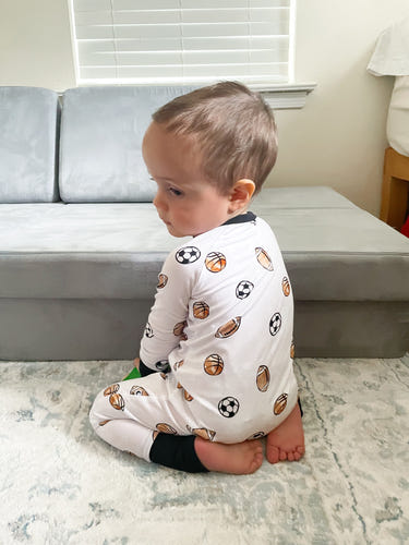 Dream Team Zippy zip pajamas for babies, featuring soft fabric and playful design for comfortable sleep.