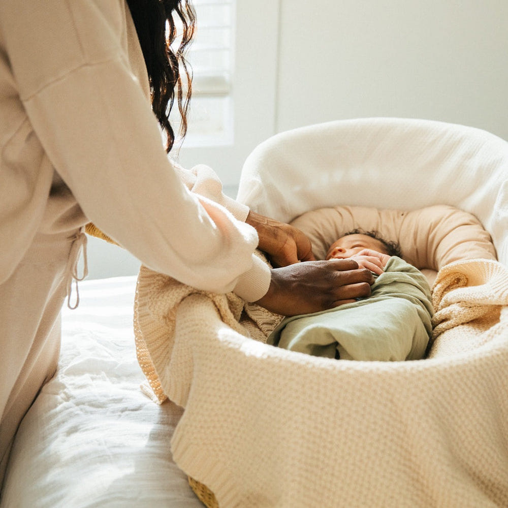 Soft macadamia knitted swaddle blanket for babies, perfect for cozy naps and stylish comfort.