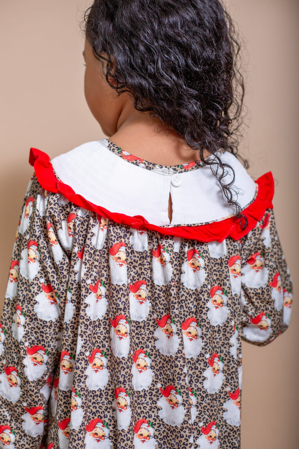 Santa baby smocked dress for infants, perfect for holiday celebrations and festive occasions.