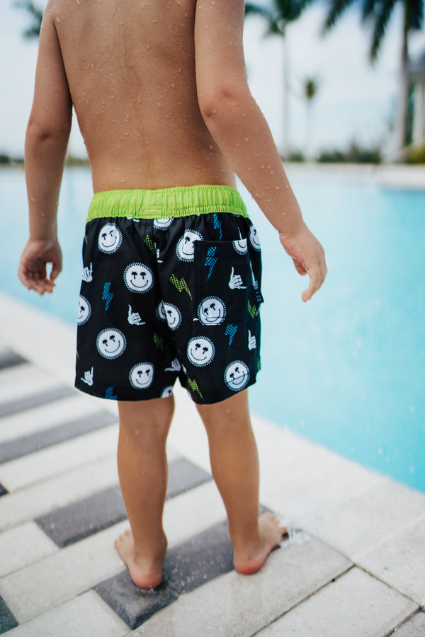 Sunshine State of Mind Swim Trunks for babies, angle view showcasing vibrant design and comfortable fit.