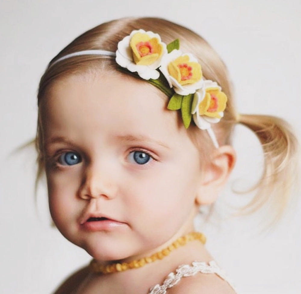 Raw Butterscotch Baltic Amber Necklace for babies, soothing teething relief and stylish accessory.