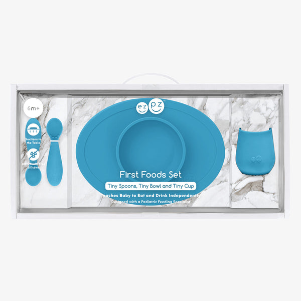 "First Foods Set for babies, featuring colorful bowls and utensils at an angle, perfect for introducing solid foods."