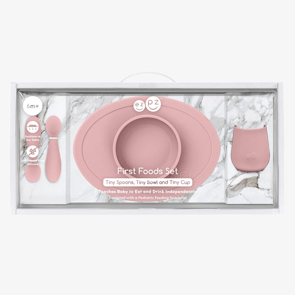 "First Foods Set for babies, featuring colorful utensils and bowls, perfect for introducing solid foods."