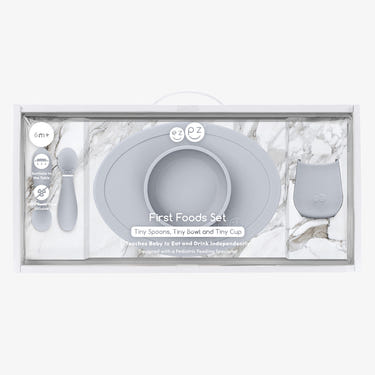 "First Foods Set for babies, featuring colorful bowls, spoons, and accessories for easy feeding."