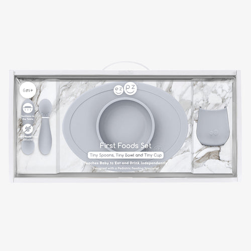 "First Foods Set for babies, featuring colorful bowls, spoons, and accessories for easy feeding."
