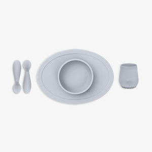 "First Foods Set for babies, featuring colorful bowls and utensils, perfect for introducing solids at mealtime."