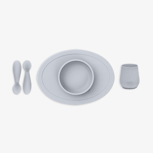 "First Foods Set for babies, featuring colorful bowls and utensils, perfect for introducing solids at mealtime."