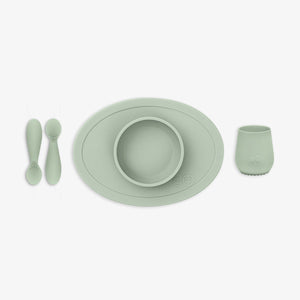 "First Foods Set for babies, featuring colorful utensils and bowls at an angle view, perfect for introducing solids."
