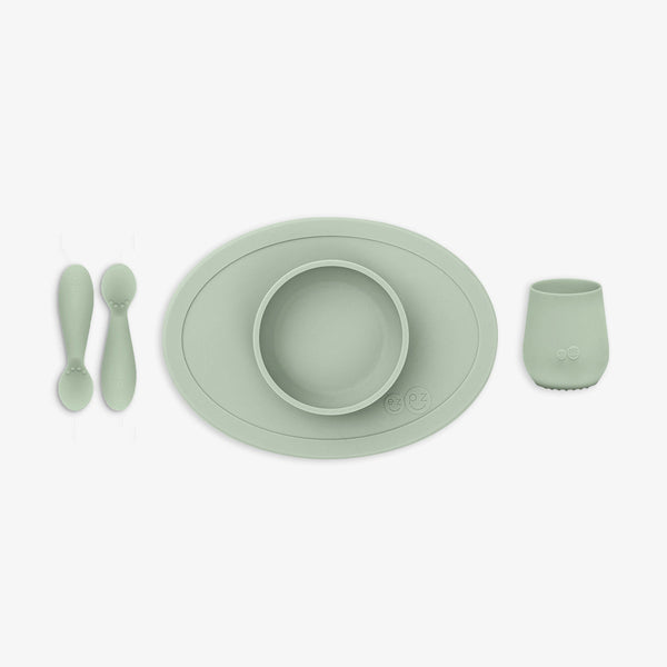 "First Foods Set for babies, featuring colorful utensils and bowls at an angle view, perfect for introducing solids."