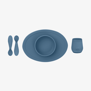 "First Foods Set for babies, featuring colorful bowls and utensils, perfect for introducing solids at angle 17."