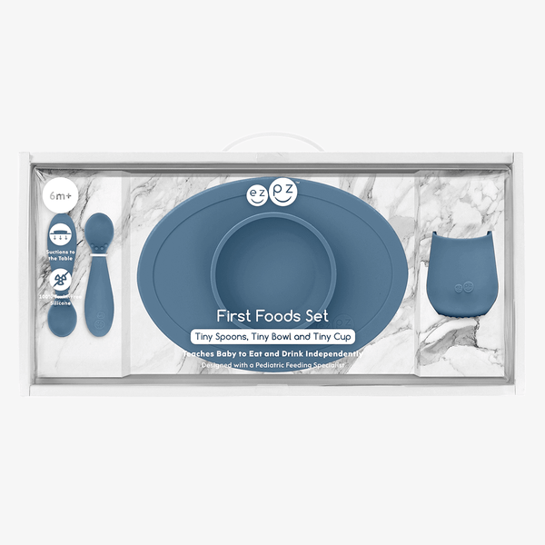 "First Foods Set for babies, featuring colorful utensils and bowls, perfect for introducing solid foods."