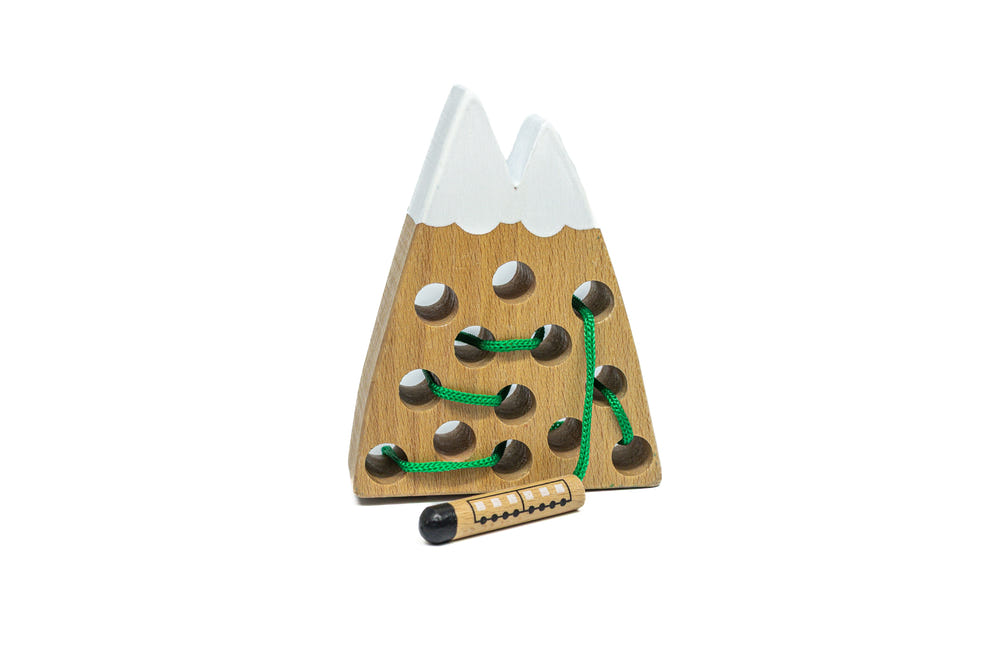 "Mountain Montessori Toy: Natural wooden teether for soothing babies, promoting sensory exploration and development."