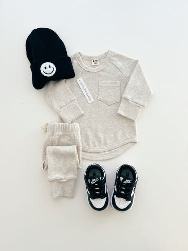 Oatmeal baby lounge set, soft and cozy, perfect for comfortable playtime and relaxation.