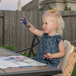 "Willow Bapron for babies, stylish and functional, shown at angle 11 for a clear view of design and fabric."