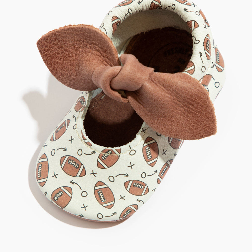 First Down Knotted Bow Baby Shoe - Stylish and comfy bow mocc for infants, perfect for any occasion.