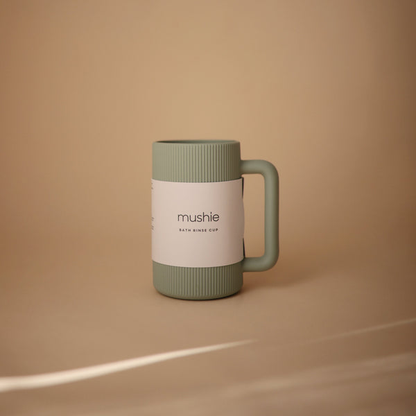 Colorful bath rinse cup for babies, angled view showcasing its ergonomic design and easy grip for bath time fun.