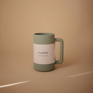 Colorful bath rinse cup for babies, angled view showcasing its ergonomic design and easy grip for bath time fun.