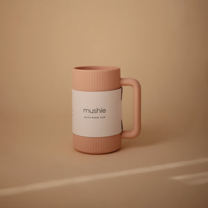 Baby bath rinse cup at a 40-degree angle, perfect for gentle rinsing during bath time.