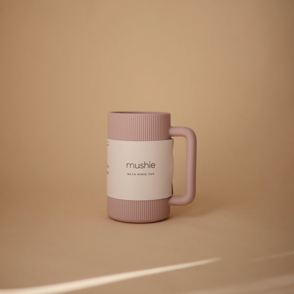 Colorful bath rinse cup for babies, designed for easy pouring and gentle rinsing during bath time.