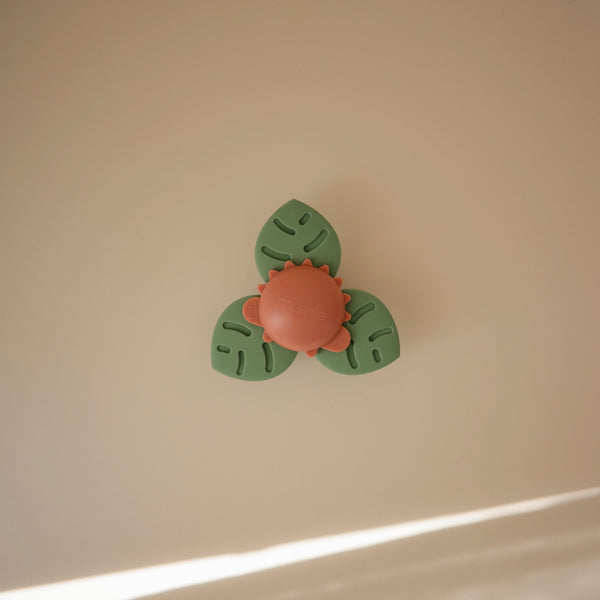 Colorful Dino Suction Spinner Toy for babies, perfect for fun bath time play.