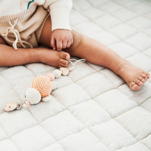 Natural French linen baby playmat at angle 3, perfect for playtime and safe for infants.
