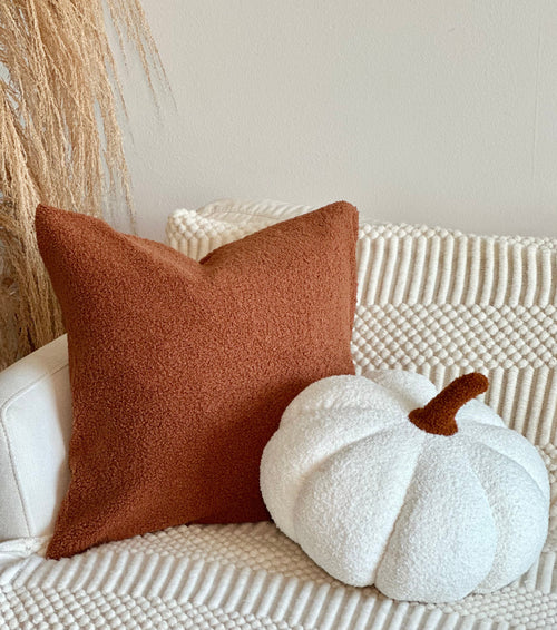 Jumbo Sherpa cream pumpkin pillow at an angle, perfect for cozy nursery decor and baby comfort.