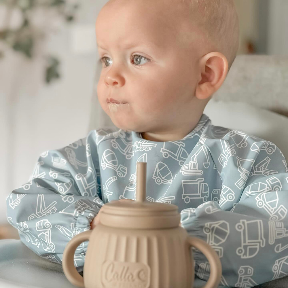 Grayson Long Sleeve Bib in Construction design, perfect for messy eaters and playful toddlers.