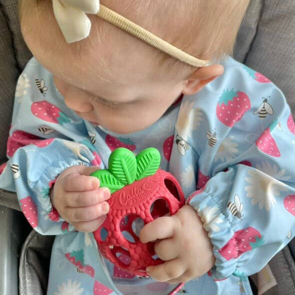 Strawberry Patch Teether for babies - safe, soft, and soothing for teething relief.