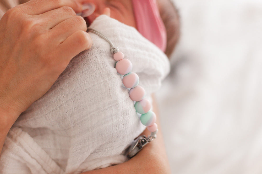 Cotton Candy Pacifier Clip for babies - stylish and secure accessory to keep pacifiers close and clean.