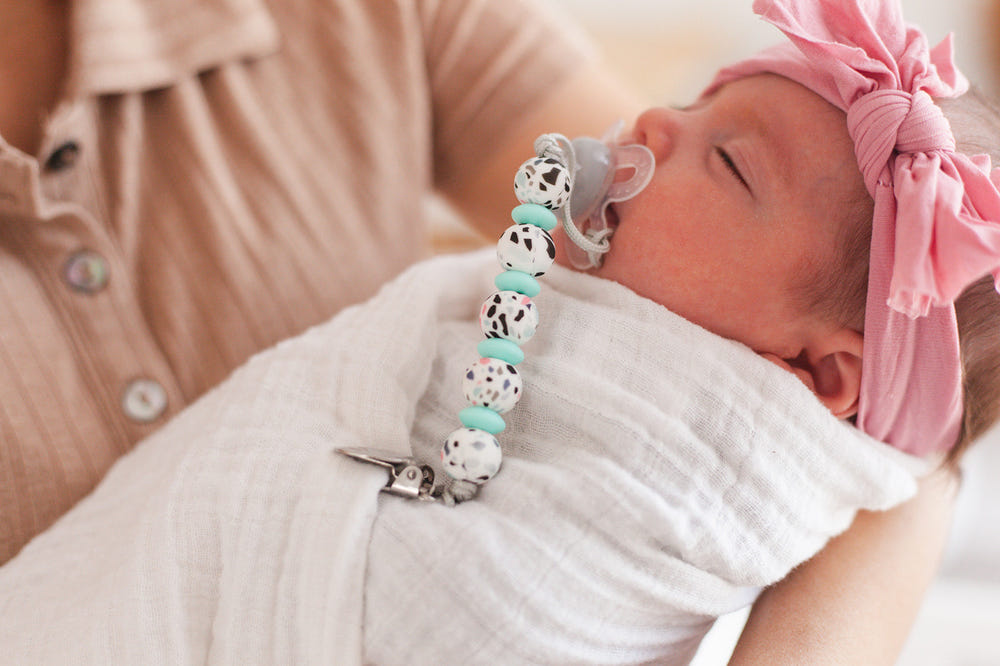 "Lauren Clip in Terrazo design - stylish pacifier clip for babies."